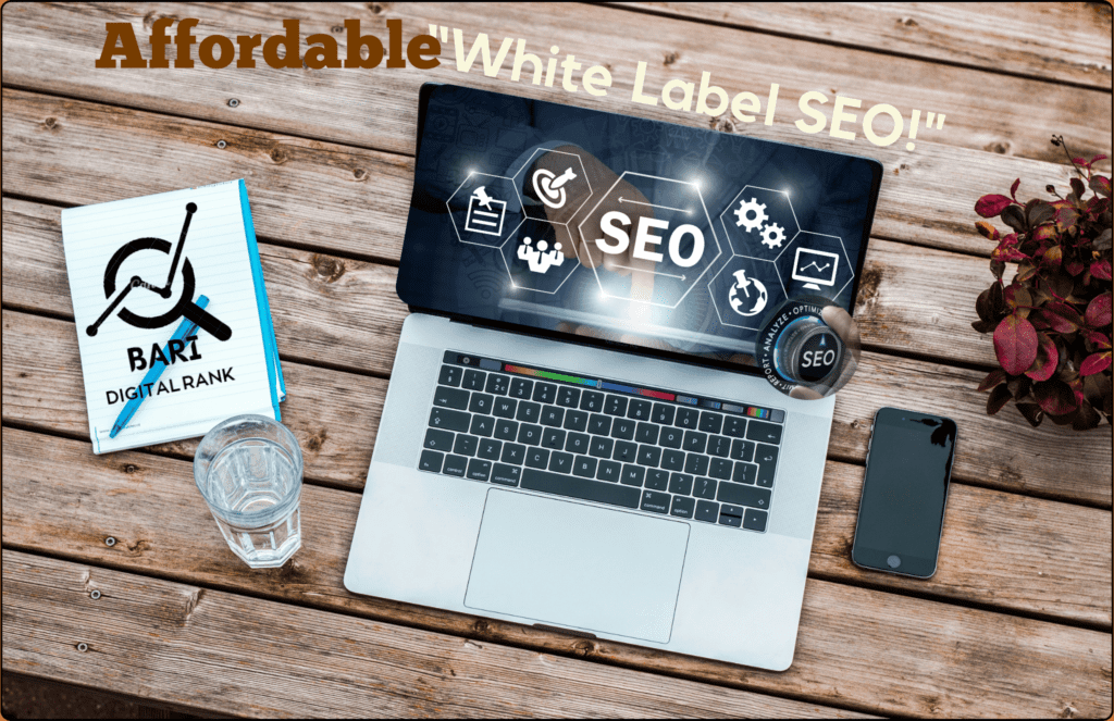 Laptop showing SEO icons with text "Affordable White Label SEO" beside a notebook and smartphone on a wooden table.